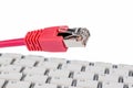 Network cable on keyboard Royalty Free Stock Photo