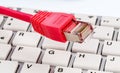Network cable on keyboard Royalty Free Stock Photo