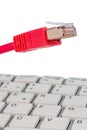 Network cable on keyboard Royalty Free Stock Photo