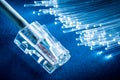 Network cable and optical fibers with lights in the ends at the background