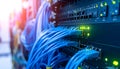 Network cables connected to switches with LED lights in a server rack Royalty Free Stock Photo