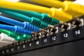 Network cables connecting into server rack ports Royalty Free Stock Photo