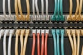 Network cables in various colors connected to a patch panel, showcasing organized wiring and connectivity in a modern Royalty Free Stock Photo