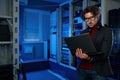 Network engineer using digital tablet in server room during maintenance work Royalty Free Stock Photo