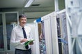 Network engineer working in server room Royalty Free Stock Photo