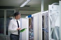 Network engineer working in server room Royalty Free Stock Photo