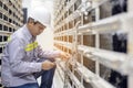 Network engineer working with tablet  in server data center room, professional skilled technician Royalty Free Stock Photo