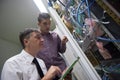 Network engineers in server room Royalty Free Stock Photo