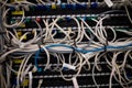Network patch panel is being shown with tangled Ethernet cables and RJ45 connectors in flat design Royalty Free Stock Photo