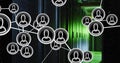 Network of people icons moving over green lit, dark computer server room Royalty Free Stock Photo
