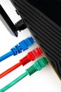 Network router with colored Ethernet cables connected for internet access and data transfer Royalty Free Stock Photo
