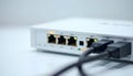 Network router with connected ethernet cables, showing active data transfer and internet connectivity Royalty Free Stock Photo
