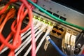 Network server rack with colorful ethernet cables on switches in a data system center Royalty Free Stock Photo