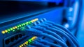 Network Switch with Blinking Lights and Blue Ethernet Cables Royalty Free Stock Photo
