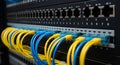 A network switch is displayed with multiple Ethernet cables plugged into its RJ-45 Royalty Free Stock Photo
