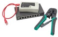Network switch, ethernet cable, crimper and RJ45 cable tester Royalty Free Stock Photo