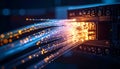Closeup of fiber optic cables connected to network switch with glowing orange and blue lines Royalty Free Stock Photo