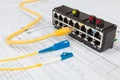 Network switch, optical and UTP ethernet cables Royalty Free Stock Photo