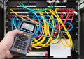 Network test. Qualified cable performance tester in human hand detail Royalty Free Stock Photo