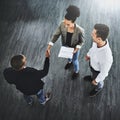 Network to let more people know about your business. High angle shot of two businesspeople shaking hands in an office. Royalty Free Stock Photo