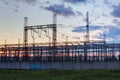 Network at transformer station in sunrise, high voltage