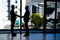 Networking is essential to get ahead. two businessmen shaking hands in an office. Royalty Free Stock Photo