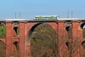 Netzschkau, Germany - April 30, 2023: Vogtland regional train crosses the Goltzsch Viaduct, the largest brick-built railway bridge