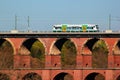 Netzschkau, Germany - April 30, 2023: Vogtland regional train crosses the Goltzsch Viaduct, the largest brick-built railway bridge