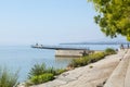 Neuchatel,Switzerland-Sept.05.2018:Neuchatel lake in Switzerland seen from the port promenade of Estavayer-le-Lac, with plants and Royalty Free Stock Photo