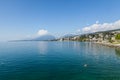 Neuchatel,Switzerland-Sept.05.2018:Neuchatel lake in Switzerland seen from the port promenade of Estavayer-le-Lac, with plants and Royalty Free Stock Photo