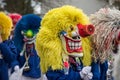 People with carnival mask of waggis parading in the street