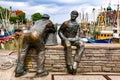 Neuharlingersiel, East Frisia, Germany, 07-04-2021:Neuharlingersiel with bronze monument of two fishermen created by the Petersen