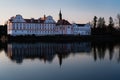 Neuhaus Castle is reflected in the evening light on the surface of the Inn Royalty Free Stock Photo