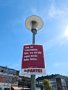 Neumuenster, Germany - 16. April 2022: An election poster of the German party named Die Partei on a lamppost before the state Royalty Free Stock Photo