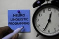 Neuro Linguistic Programming - NLP text on sticky notes isolated on office desk