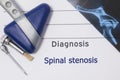 Neurological diagnosis of Spinal Stenosis. Neurologist directory, where is printed diagnosis Spinal Stenosis, lies on workplace wi