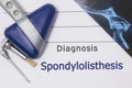 Neurological diagnosis of Spondylolisthesis. Neurologist directory, where is printed diagnosis Spondylolisthesis, lies on workplac Royalty Free Stock Photo