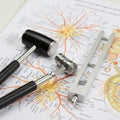 Neurological diagnostic tools including a reflex hammer, tuning forks, and a neurotest Royalty Free Stock Photo