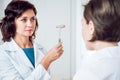 Neurological examination. The neurologist testing reflexes on a female patient Royalty Free Stock Photo