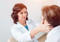 Neurological examination. The neurologist testing reflexes on a female patient Royalty Free Stock Photo
