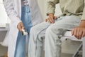 Neurologist checks knee reflex of child patient during medical checkup in clinic Royalty Free Stock Photo