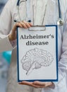 Neurologist doctor holds clipboard with Alzheimer's disease and