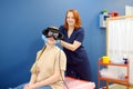 Neurologist performing positional testing of patient using videonystagmography . VNG testing uses goggles with infrared cameras to