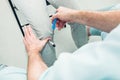 The neurologist testing knee reflex on a female patient using a hammer. Neurological physical examination. Selective focus, close Royalty Free Stock Photo