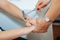 The neurologist testing reflex on a female patient using a hammer Royalty Free Stock Photo