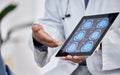 Neurology, healthcare and doctor with tablet in hands for brain research, test results or cancer innovation in hospital