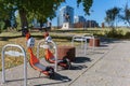 Neuron electric scooters parked at a rack in Calgary, Canada