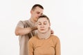 Neurosurgeon puts neck bandage on girl to stabilize the cervical region in case of neck pain, injuries and sprains on