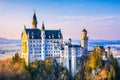 Neuschwanstein, beautiful fairytale castle near Munich in Bavaria, Germany, with colorful trees.