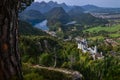 Neuschwanstein castle on Alps background in vicinity of Munich, Bavaria, Germany, Europe. Autumn landscape with castle Royalty Free Stock Photo